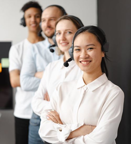 A diverse group of office workers smiling and feeling refreshed.